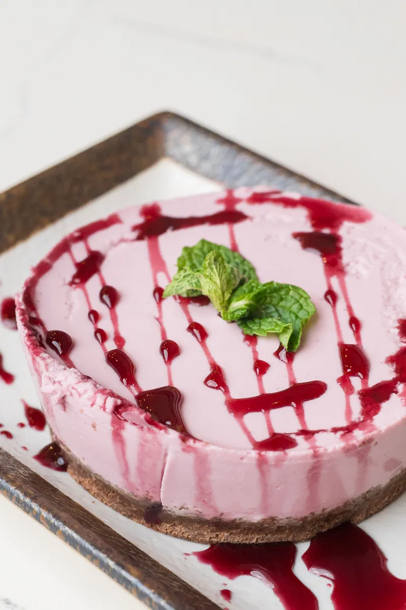 Chicha morada cheesecake — purple corn cheesecake on a chocolate cookie crust